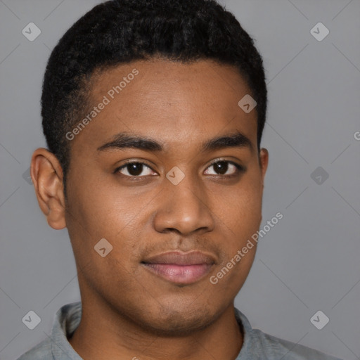 Joyful black young-adult male with short  brown hair and brown eyes