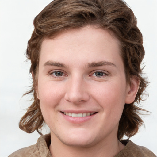 Joyful white young-adult female with medium  brown hair and blue eyes