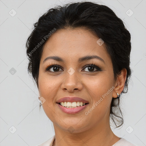 Joyful latino young-adult female with medium  brown hair and brown eyes