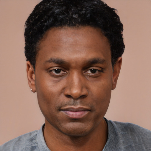 Neutral black young-adult male with short  black hair and brown eyes