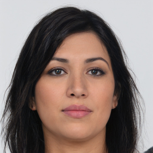 Joyful asian young-adult female with long  brown hair and brown eyes
