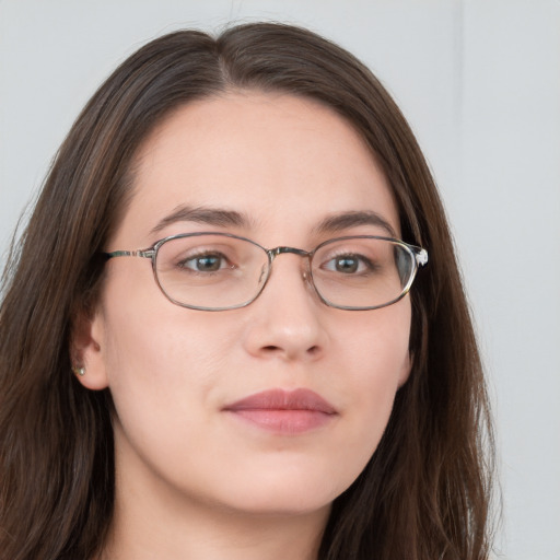 Neutral white young-adult female with long  brown hair and grey eyes