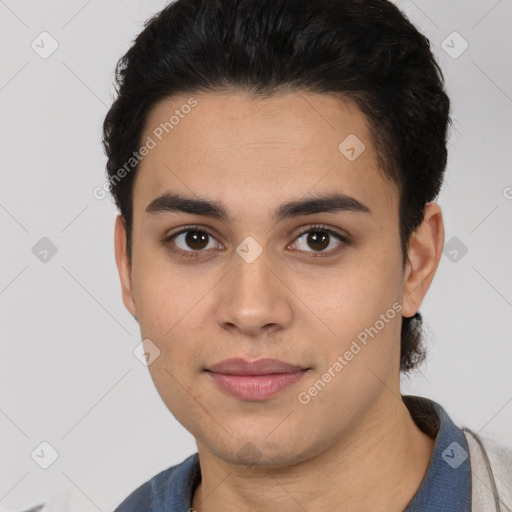 Joyful white young-adult male with short  black hair and brown eyes