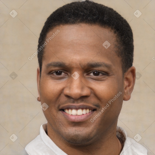 Joyful latino young-adult male with short  brown hair and brown eyes