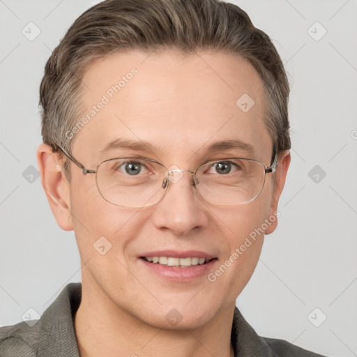 Joyful white adult male with short  brown hair and grey eyes