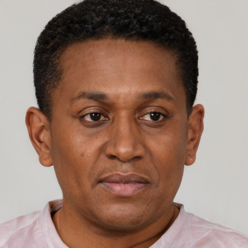 Neutral latino adult male with short  brown hair and brown eyes