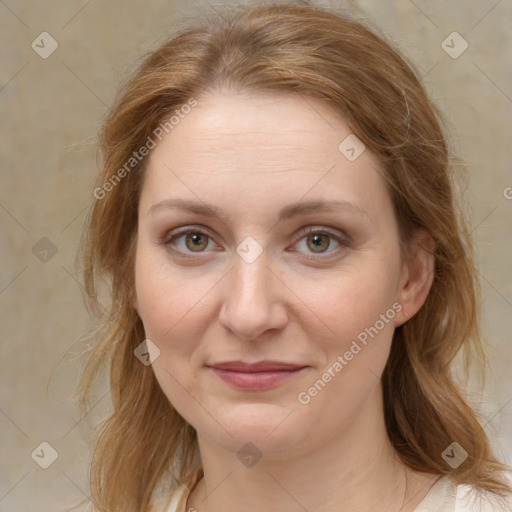 Joyful white young-adult female with medium  brown hair and green eyes