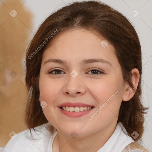 Joyful white child female with medium  brown hair and brown eyes