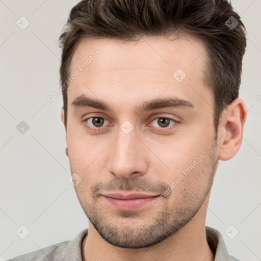 Neutral white young-adult male with short  brown hair and brown eyes