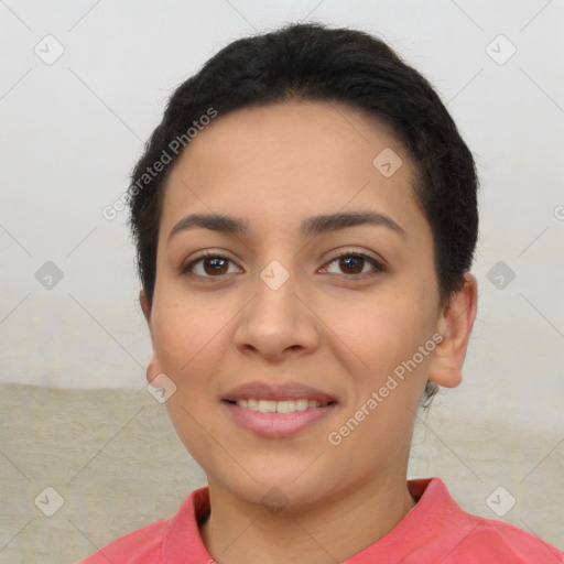 Joyful latino young-adult female with short  black hair and brown eyes