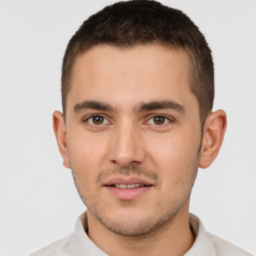 Joyful white young-adult male with short  brown hair and brown eyes