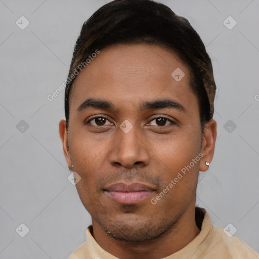 Joyful latino young-adult male with short  brown hair and brown eyes