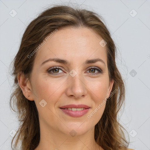 Joyful white young-adult female with long  brown hair and green eyes