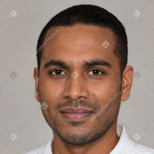 Joyful black young-adult male with short  black hair and brown eyes