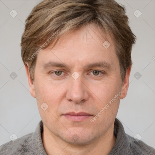 Neutral white adult male with short  brown hair and grey eyes