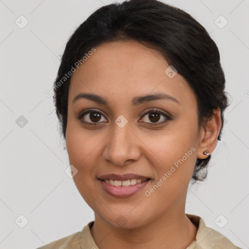 Joyful latino young-adult female with medium  brown hair and brown eyes