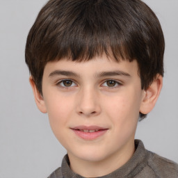 Joyful white child male with short  brown hair and brown eyes