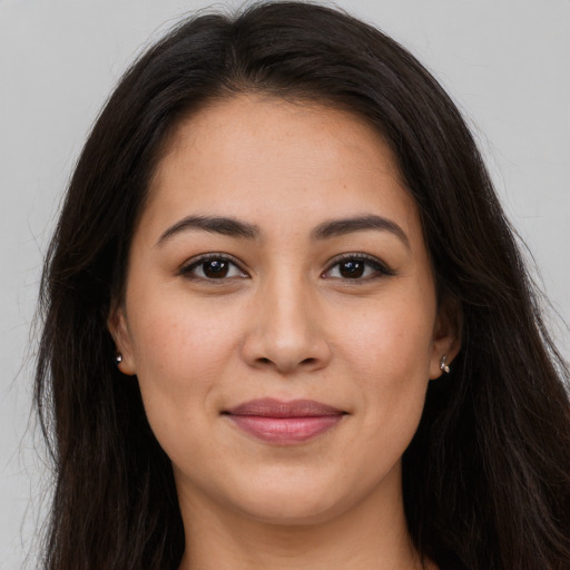 Joyful white young-adult female with long  brown hair and brown eyes