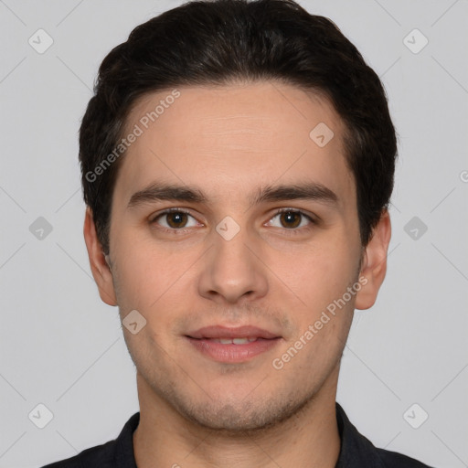 Joyful white young-adult male with short  brown hair and brown eyes