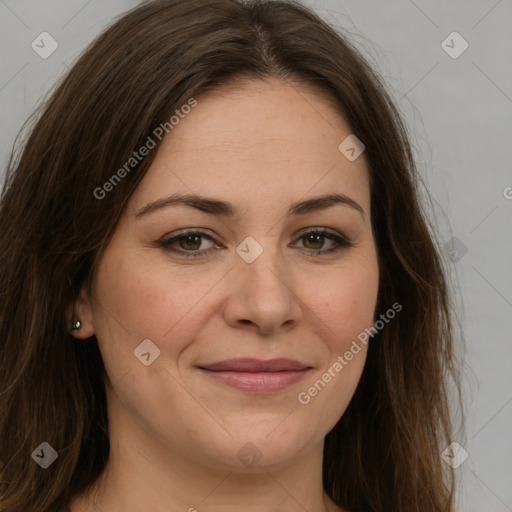 Joyful white young-adult female with long  brown hair and green eyes