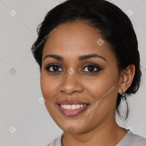 Joyful latino young-adult female with medium  brown hair and brown eyes