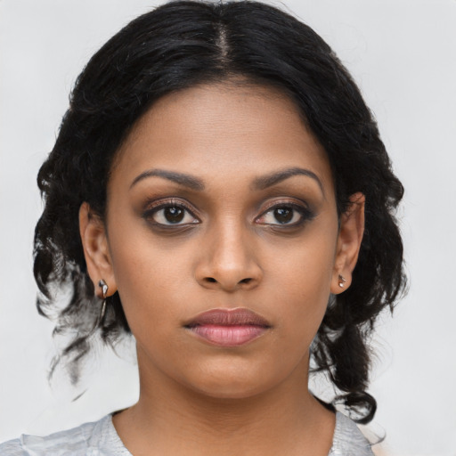 Neutral black young-adult female with medium  black hair and brown eyes