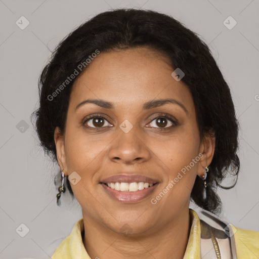 Joyful black adult female with medium  brown hair and brown eyes