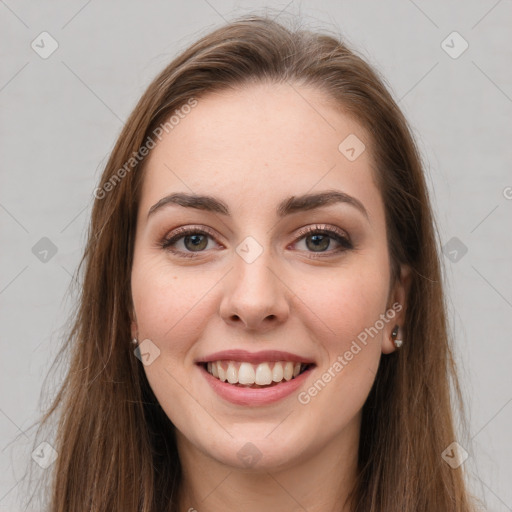 Joyful white young-adult female with long  brown hair and grey eyes