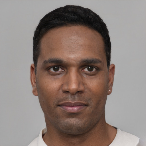 Neutral black young-adult male with short  black hair and brown eyes