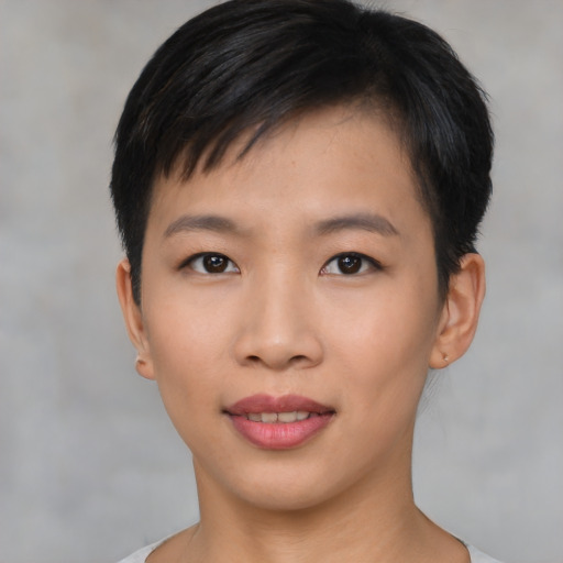 Joyful asian young-adult female with short  black hair and brown eyes