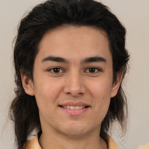 Joyful white young-adult male with medium  brown hair and brown eyes