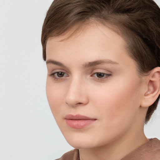 Neutral white young-adult female with short  brown hair and brown eyes