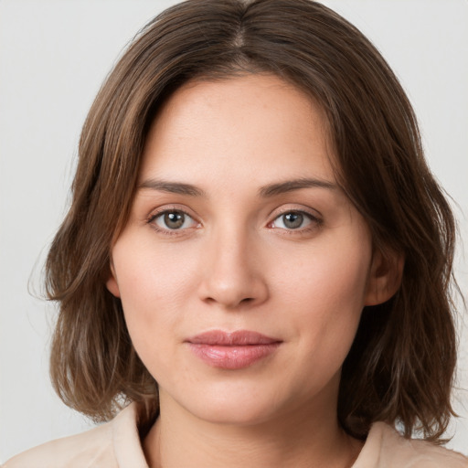 Neutral white young-adult female with medium  brown hair and green eyes