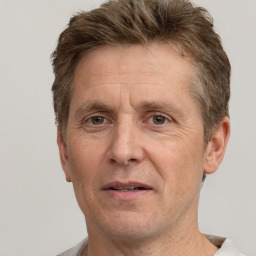 Joyful white middle-aged male with short  brown hair and brown eyes