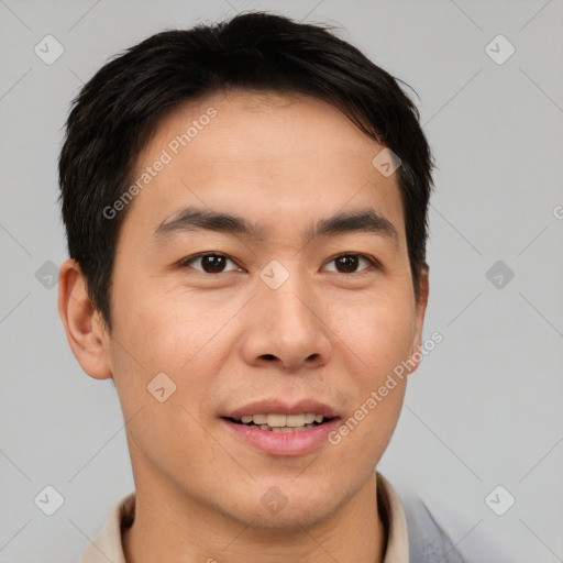 Joyful asian young-adult male with short  brown hair and brown eyes