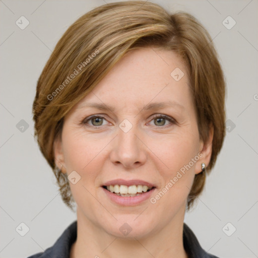 Joyful white adult female with medium  brown hair and grey eyes