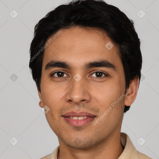 Joyful white young-adult male with short  black hair and brown eyes