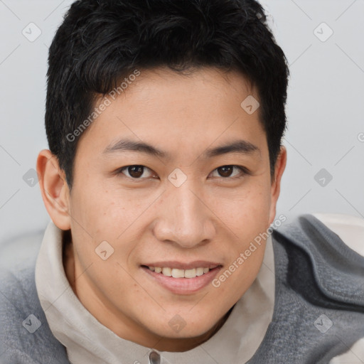 Joyful asian young-adult male with short  brown hair and brown eyes