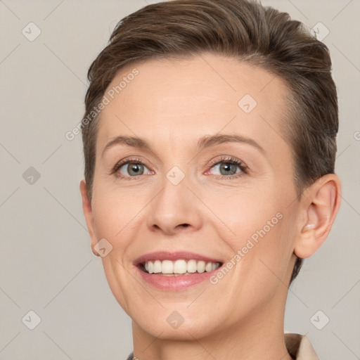 Joyful white adult female with short  brown hair and brown eyes