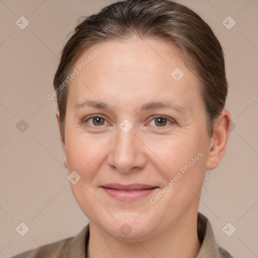 Joyful white adult female with short  brown hair and brown eyes