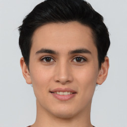 Joyful asian young-adult male with short  brown hair and brown eyes