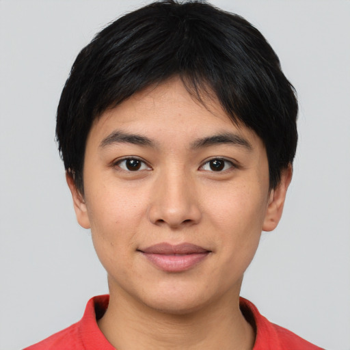 Joyful white young-adult female with short  black hair and brown eyes