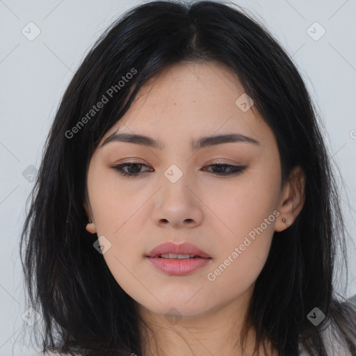 Joyful asian young-adult female with long  black hair and brown eyes