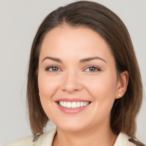 Joyful white young-adult female with medium  brown hair and brown eyes