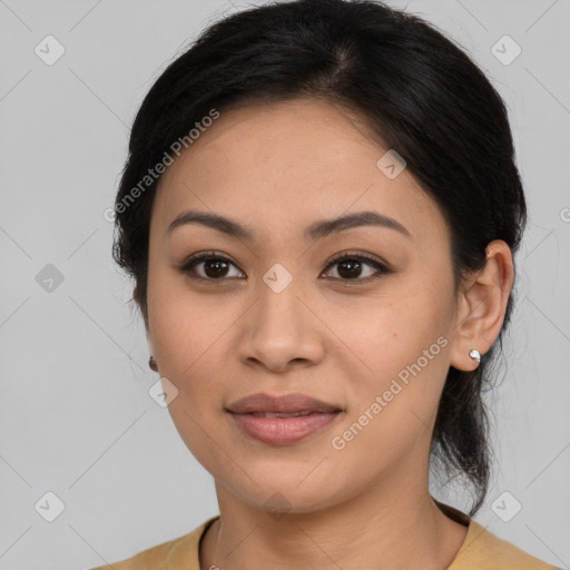 Joyful latino young-adult female with medium  black hair and brown eyes