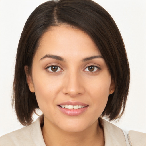 Joyful white young-adult female with medium  brown hair and brown eyes