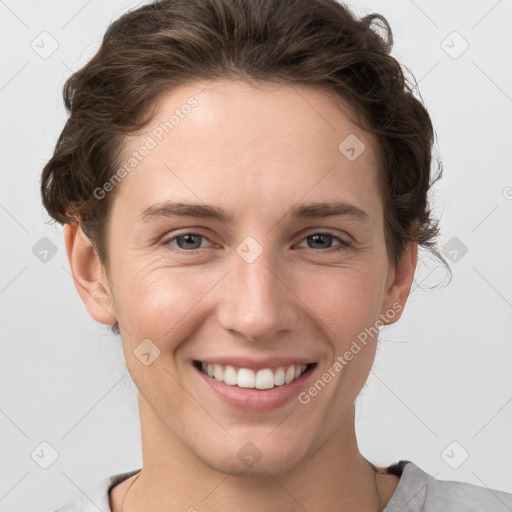 Joyful white young-adult female with short  brown hair and grey eyes