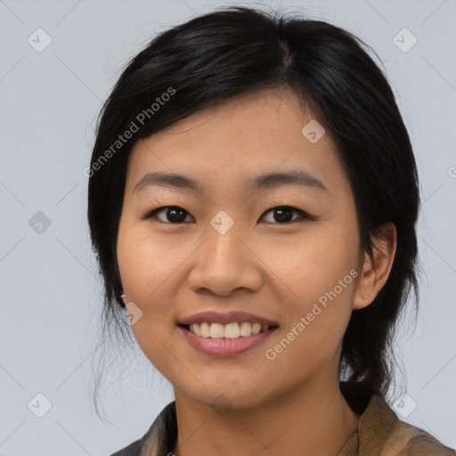 Joyful asian young-adult female with medium  black hair and brown eyes