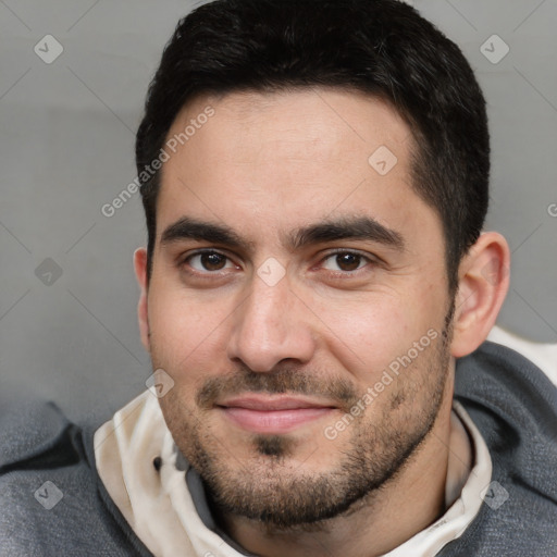 Joyful white young-adult male with short  black hair and brown eyes