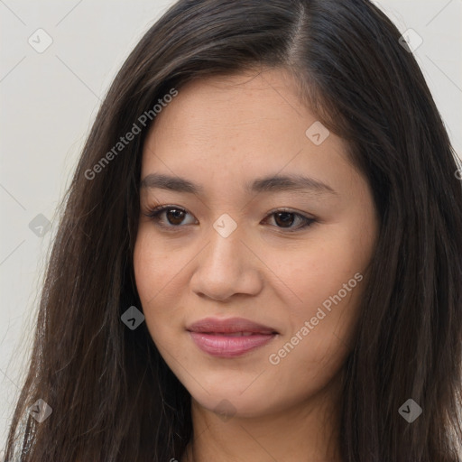 Joyful asian young-adult female with long  brown hair and brown eyes